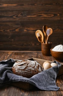 Fresh rye brown bread on wooden cutting board
