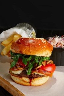Juicy beef burger with lingonberry sauce