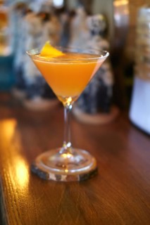 Soft focus photo of Brown Derby Cocktail. Image with shallow depth of field and contains a little noise due to poor lighting conditions