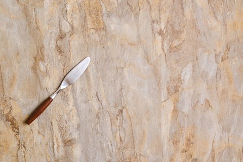 Spreading knife on empty wooden surface