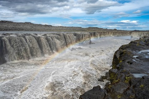 Canyon with waterfall and rainbow