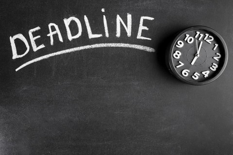 Deadline text blackboard with alarm clock