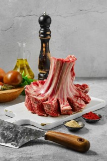Raw uncooked lamb ribs rolled in a crown