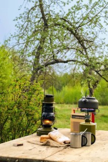 Snack outdoor in summer evening. Camping kettle