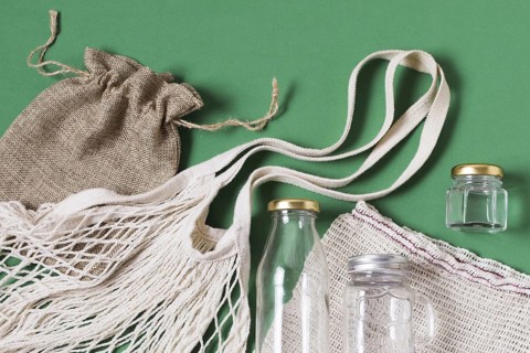 Top view different zero waste products green background. Resolution and high quality beautiful photo