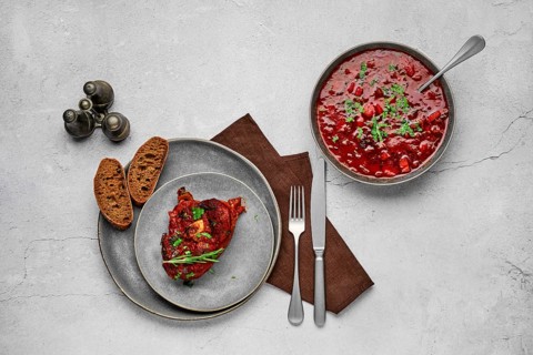 Top view of ossobuco on a plate. Slice of shank baked with wine sauce