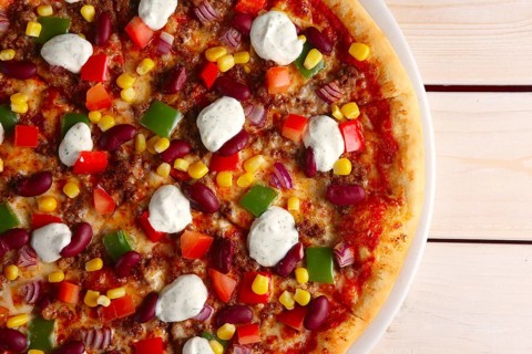 Top view of part of pizza with bean