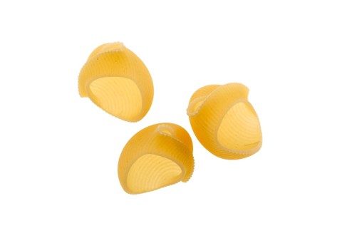Pipe rigate pasta. Organic whole wheat grooved pipes isolated on white background