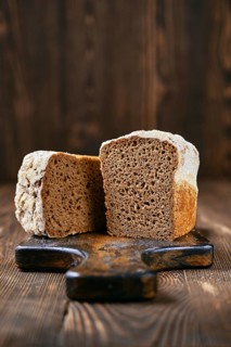 Loaf of artisan rye bread cut on half