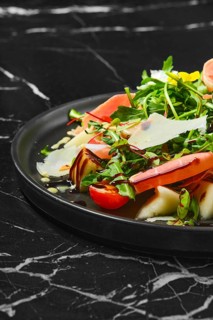 Salad with prosciutto and fresh vegetables