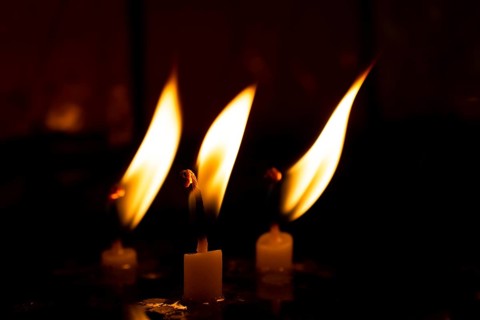 Burning candle making light in view