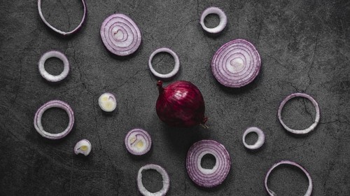 Flat lay arrangement red onion rings