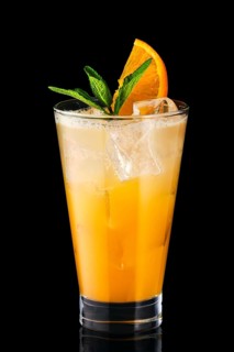 Cold fizz cocktail with orange isolated on black background