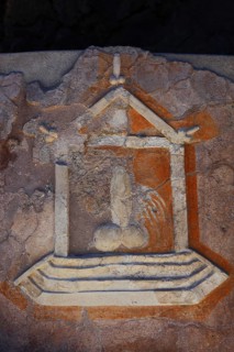 Stone relief of a penis as a reference to the brothel