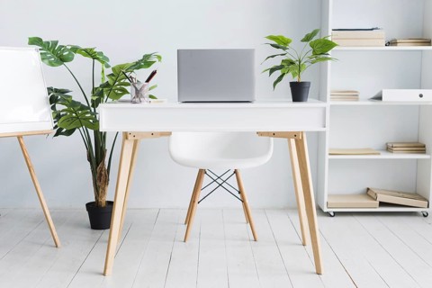 Office employee workspace with laptop table