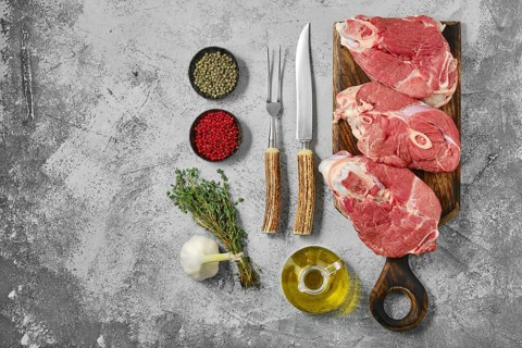 Top view of raw lamb leg cut as a steak. Slices of shank