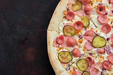 Close up view of pizza with frankfurter