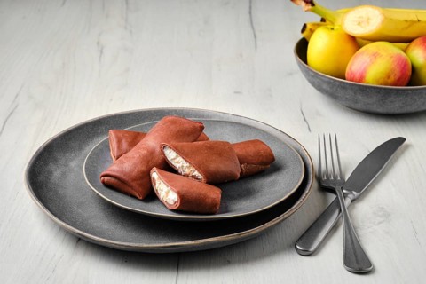 Thin chocolate pancakes stuffed with ricotta