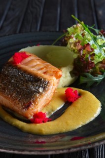 Fried salmon with mashed potato mixed with wasabi and decorated with flying fish roe