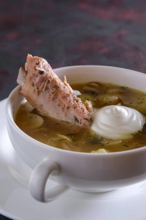 Beef bouillon with meat on a bone