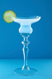 Gin tonic cocktail on blue background