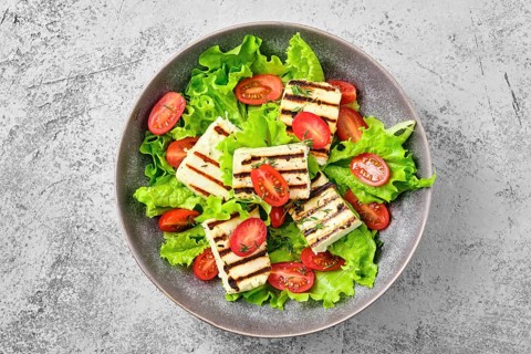 Top view of salad with grilled cheese