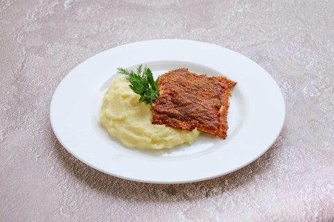 Fried hake fillet with spinach