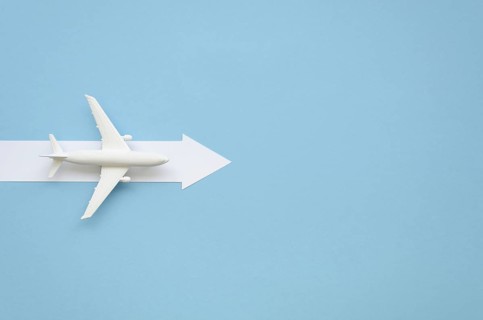Copy space airplane with arow direction