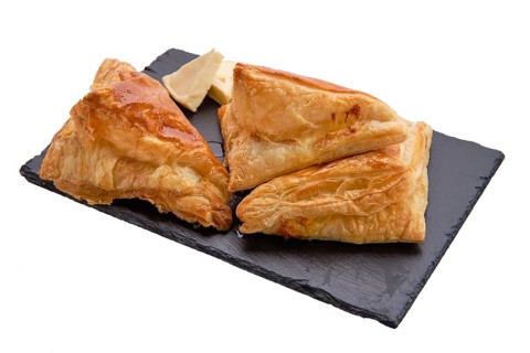 Puff pastry with cheese on slate plate