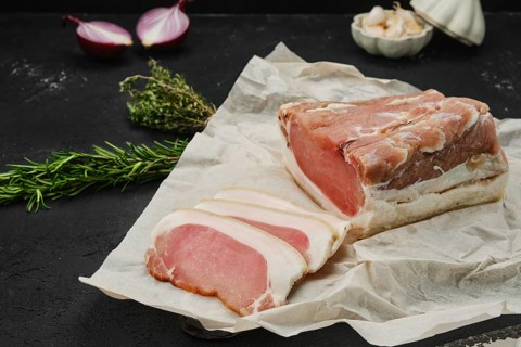 Smoked beef ham on wooden cutting board