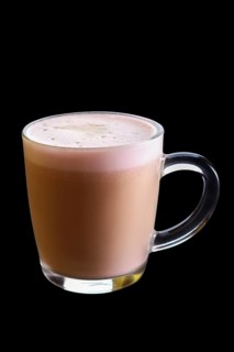 Mug with strawberry cappuccino isolated on black background