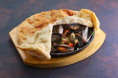 Baked oysters covered with bannock