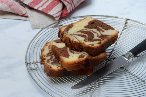 Marble cake and knife on cake rack