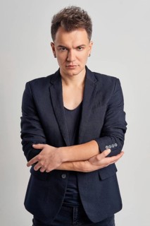 Portrait of serious man in jeans