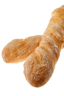 Wheat baguette bread isolated on white background