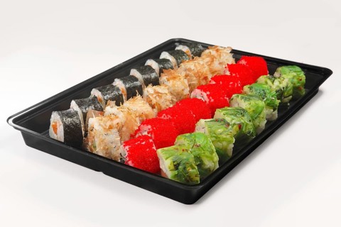 Plastic tray with set of rolls with smoked salmon