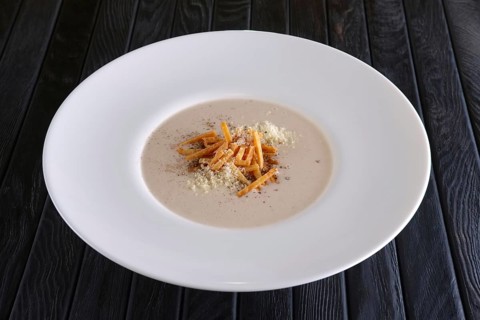 Mushroom soup puree with bacon flakes
