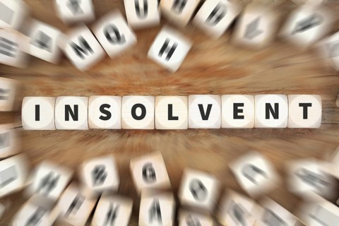 Insolvent symbolic image insolvency bankruptcy debt finance and economy money crisis as business concept with cube in Stuttgart
