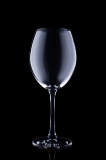 Empty wine glass isolated on black background