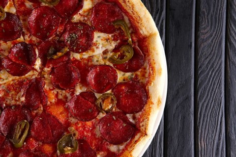 Hot pizza pepperoni with jalapeno pepper. Top view