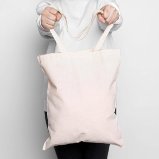 Woman standing and carrying a tote bag. Resolution and high quality beautiful photo