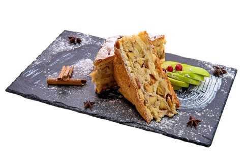 Apple pie on slate plate isolated on white