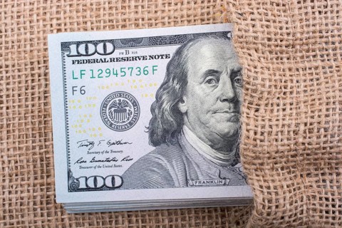 Close up of Benjamin Franklin face on 100 US dollar bill
