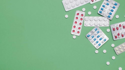 Top view pills frame green background. Resolution and high quality beautiful photo