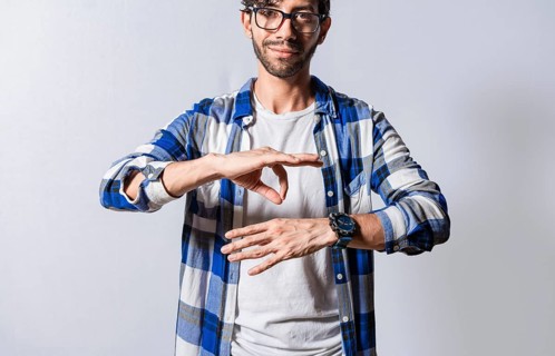 People speaking in sign language. Manual gestures of people with hearing problems. Person speaking in sign language. Deaf and dumb people speaking in sign language