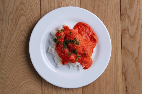 Top view of meatballs with rice on wooden table on wooden table