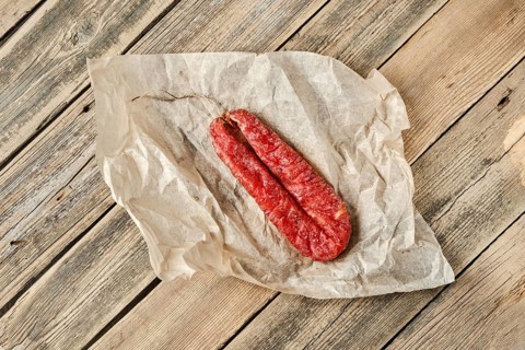 Top view of smoked dried turkey sausage on wrapping paper