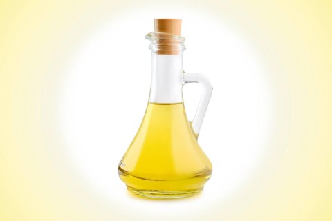Jar with vegetable oil on circular gradient background