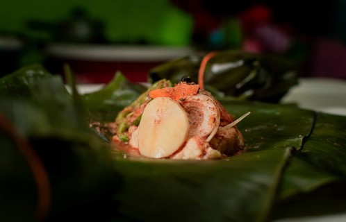 Nacatamal ingredients on banana leaves