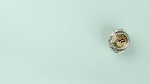 Flat lay jar with coins